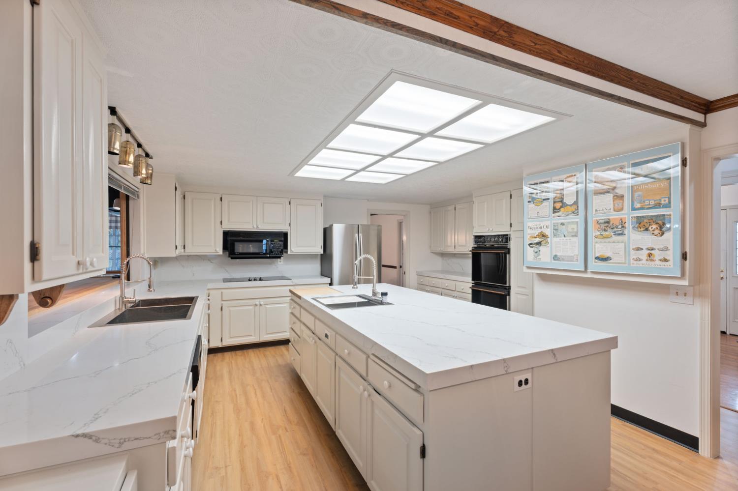 4016 Quartz Drive Santa Rosa, CA 95405 - Photo 25 of 98 a large white kitchen with a stove a sink and a refrigerator