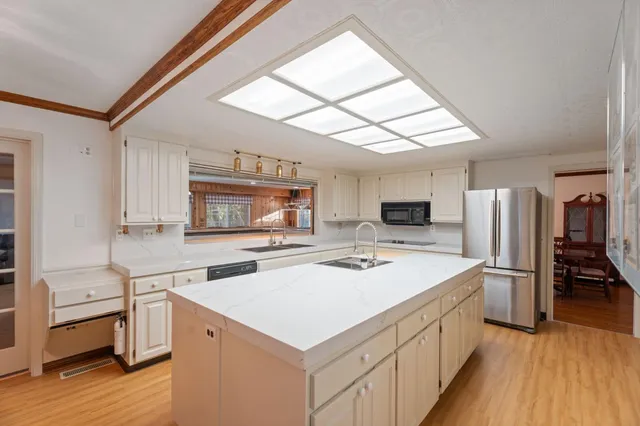 a bathroom with a sink vanity and a mirror