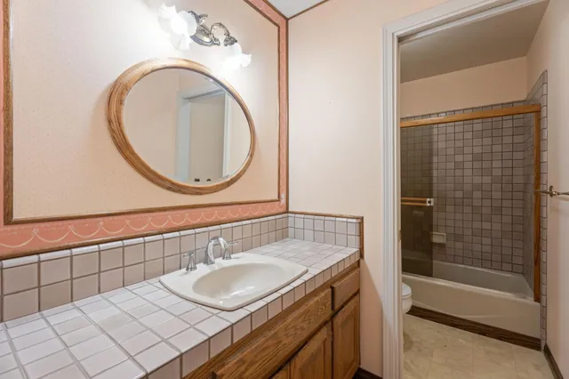 a bed room with a bed and a dresser