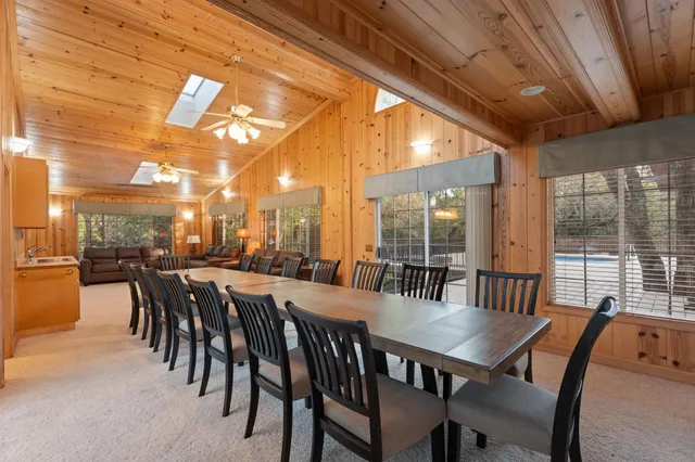 a spacious bathroom with a granite countertop sink and a mirror