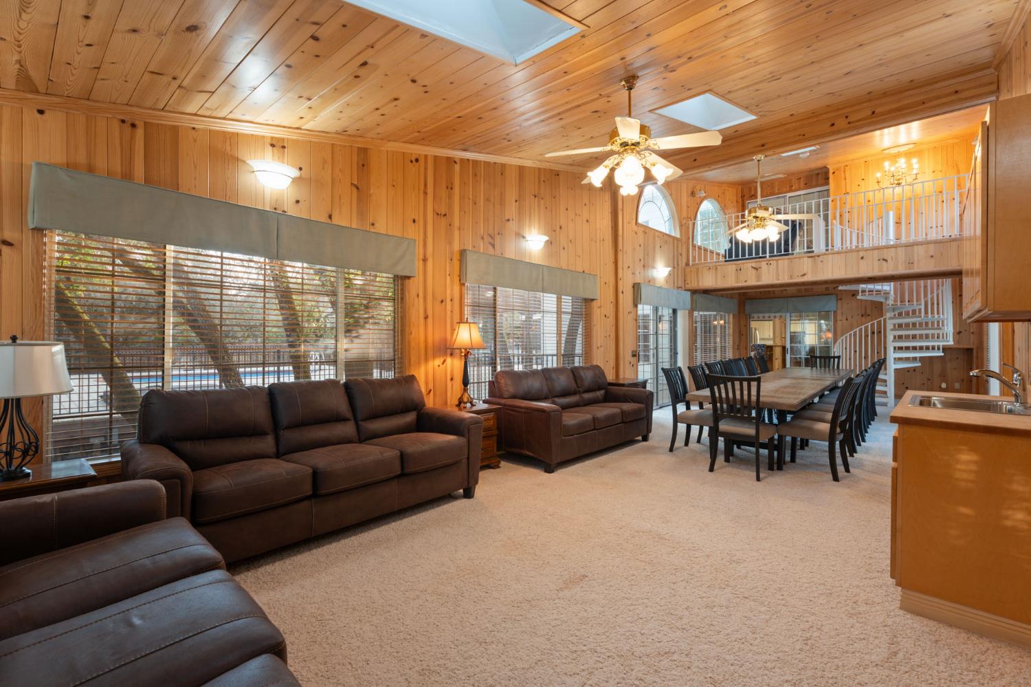 4016 Quartz Drive Santa Rosa, CA 95405 - Photo 40 of 98 a living room with furniture a chandelier and a large window