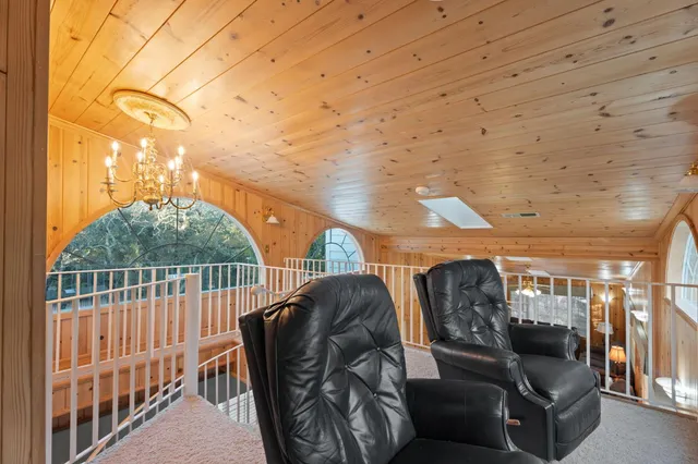 a view of a house with a backyard and a garage