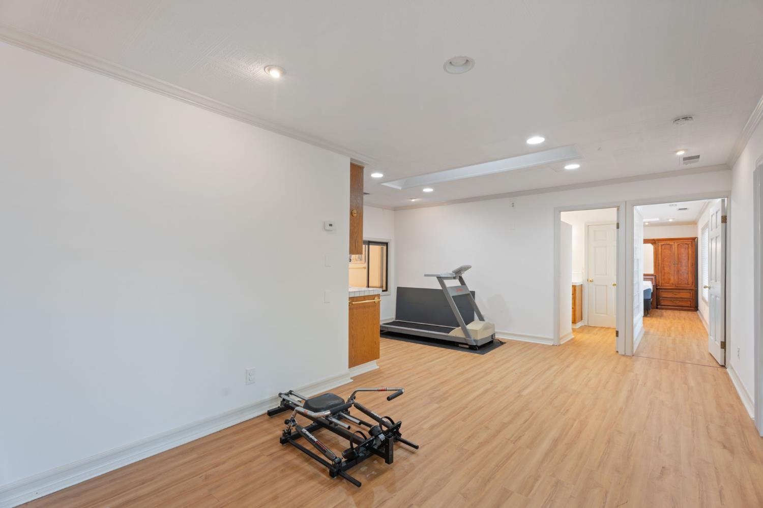 4016 Quartz Drive Santa Rosa, CA 95405 - Photo 44 of 98 a room with gym equipment and wooden floor