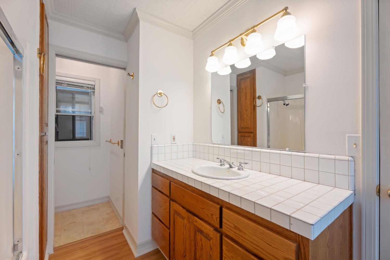 4016 Quartz Drive Santa Rosa, CA 95405 - Photo 46 of 98 a bathroom with a sink vanity and a mirror