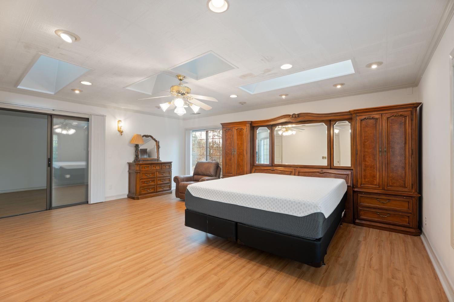 4016 Quartz Drive Santa Rosa, CA 95405 - Photo 48 of 98 a spacious bedroom with a large bed dresser and a large window