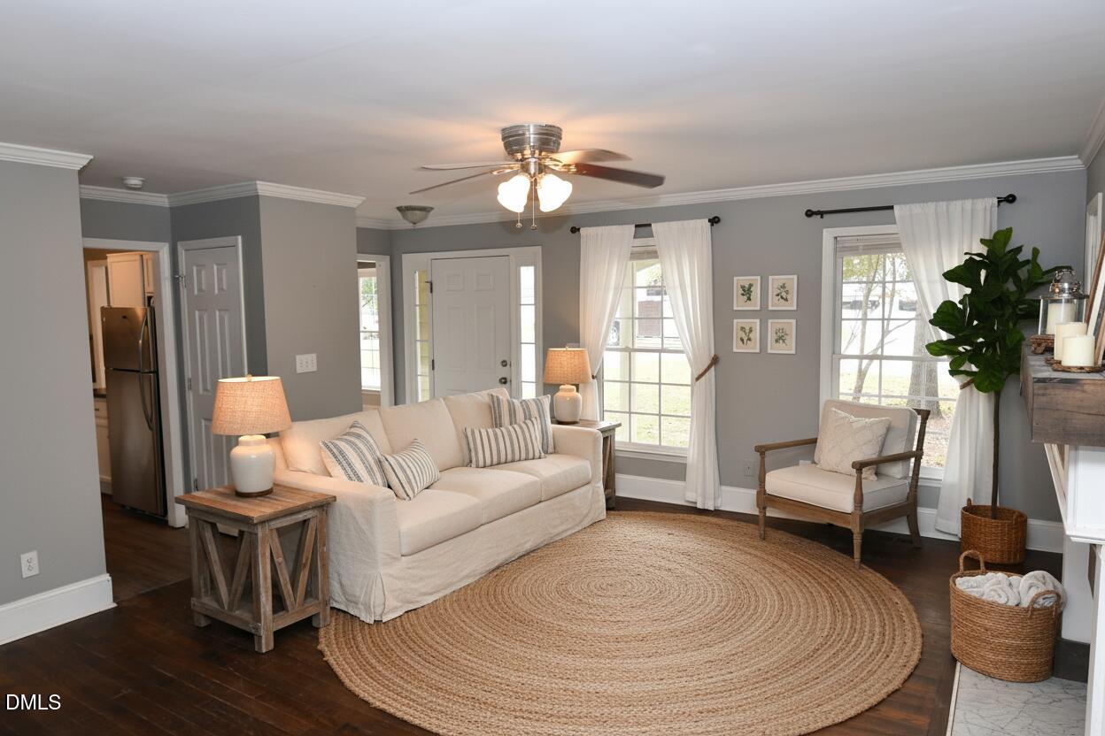 3209 Leebrook Road Raleigh, NC 27616 - Photo 6 of 30 a living room with furniture and a large window