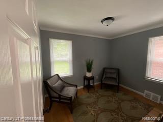19372 Sunderland Road Detroit, MI 48219 - Photo 22 of 34 Hardwood flooring complements the gray wall tones and white trim