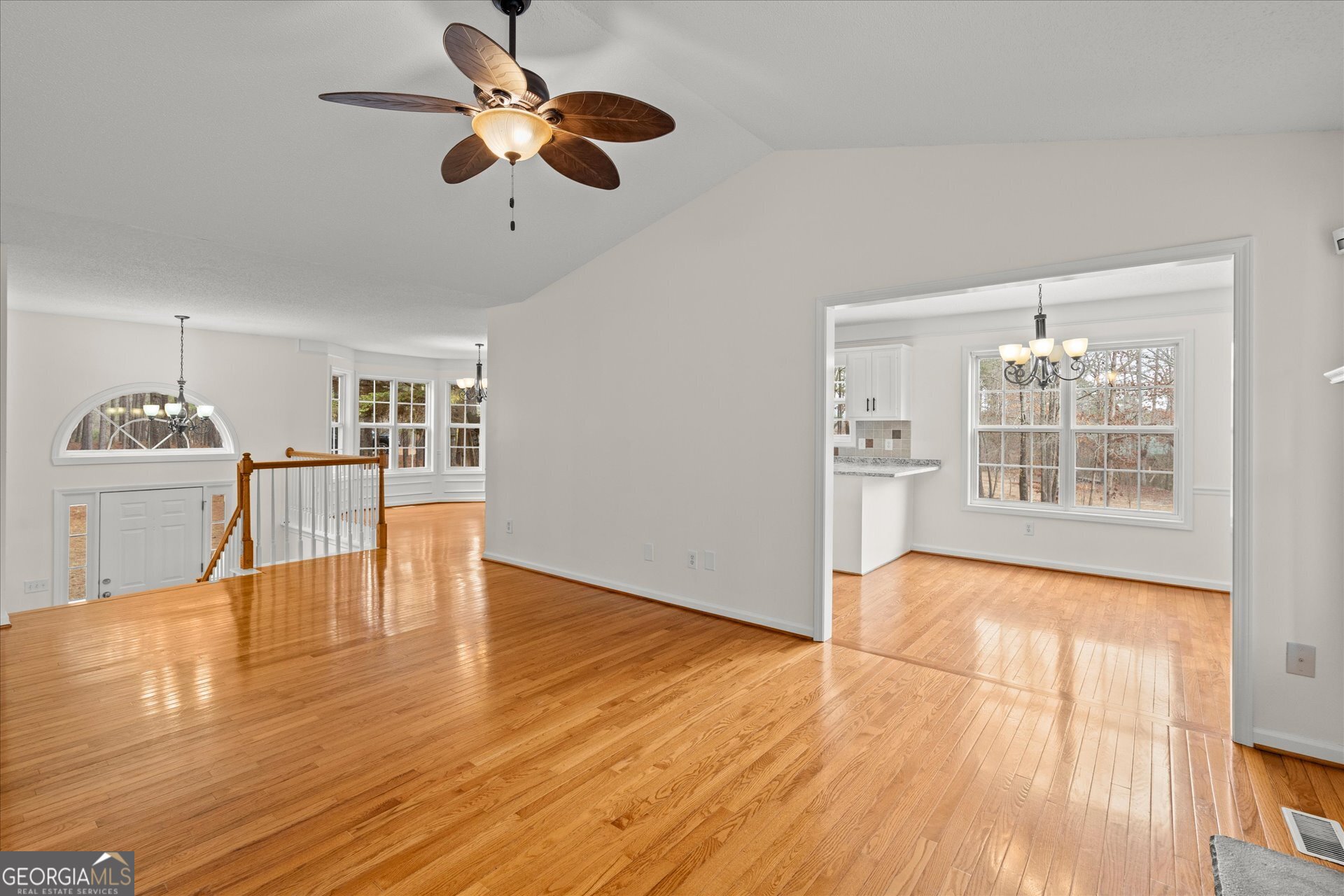 401 Tapley Road Villa Rica, GA 30180 - Photo 11 of 42 a view of an empty room with window and wooden floor