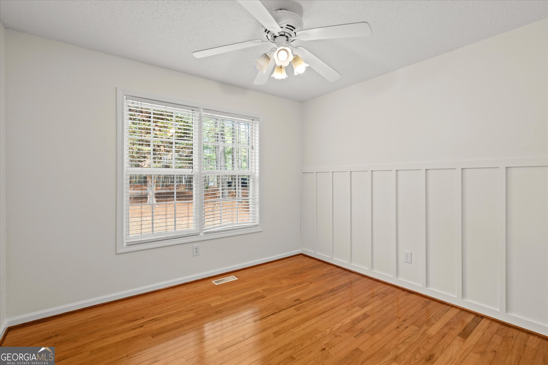 401 Tapley Road Villa Rica, GA 30180 - Photo 26 of 42 an empty room with a window and a ceiling fan
