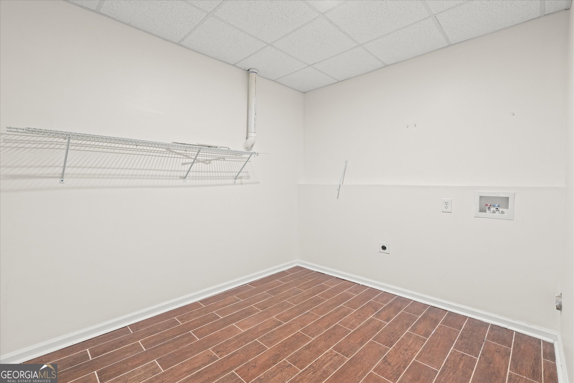 401 Tapley Road Villa Rica, GA 30180 - Photo 35 of 42 a view of a room with racks on the wall