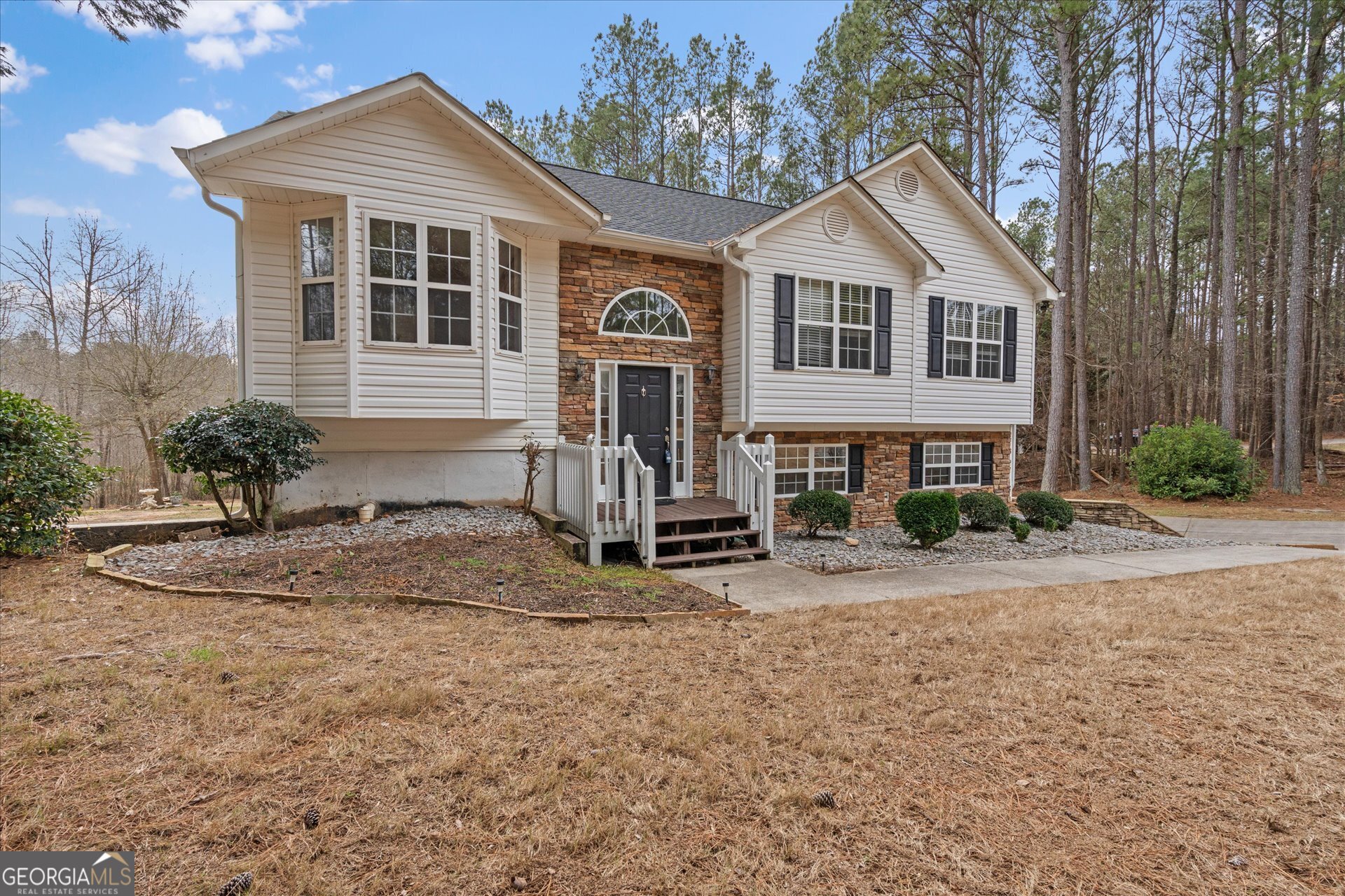 401 Tapley Road Villa Rica, GA 30180 - Photo 5 of 42 a front view of a house with garden