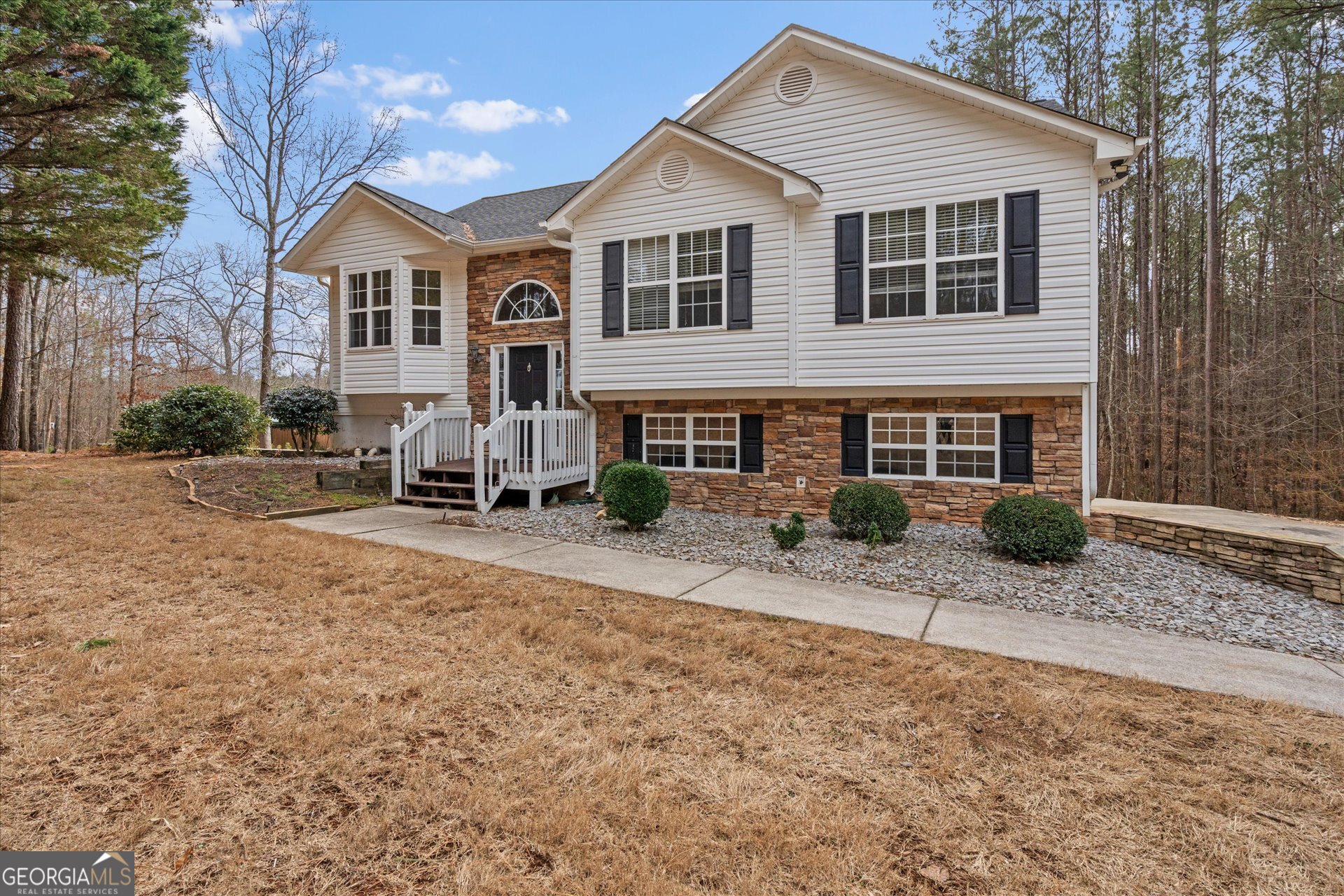 401 Tapley Road Villa Rica, GA 30180 - Photo 6 of 42 a front view of a house with a yard