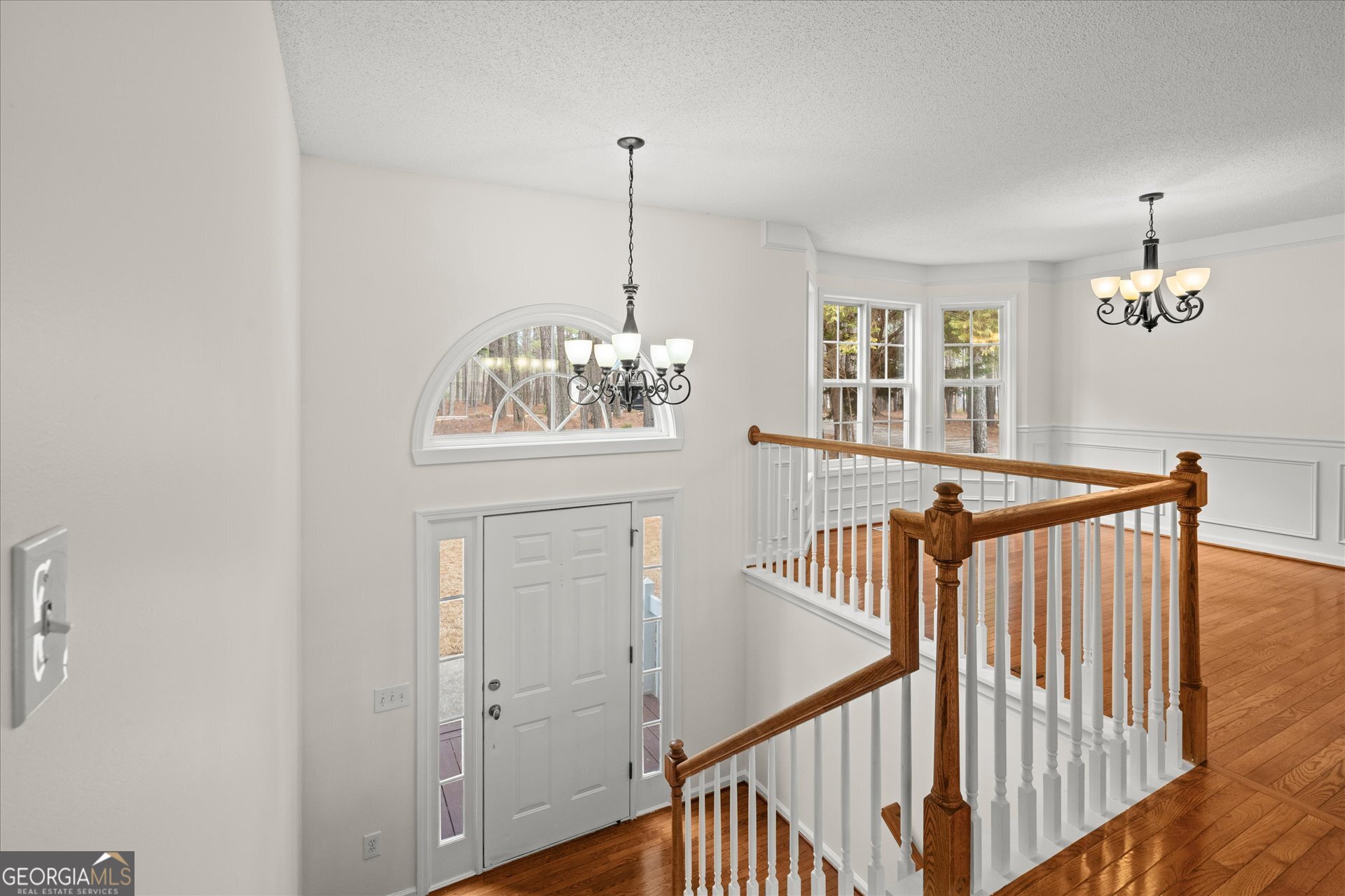 401 Tapley Road Villa Rica, GA 30180 - Photo 8 of 42 a view of a hallway with windows and chandelier