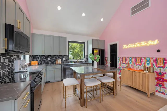 a bathroom with a sink and mirror with toilet
