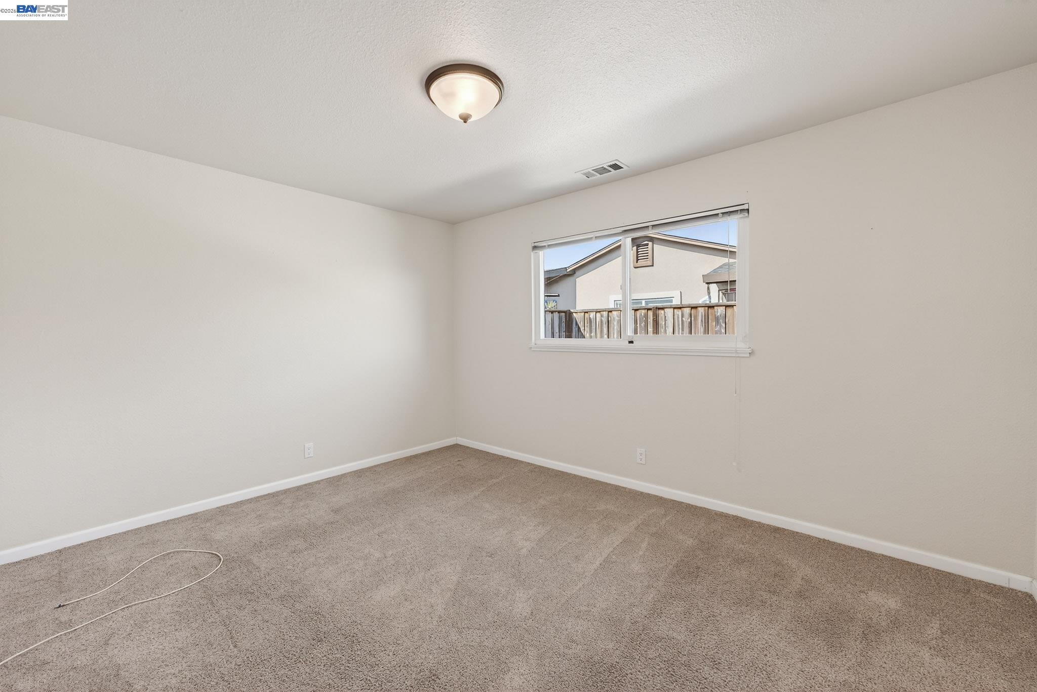 6759 Albyn Court Newark, CA 94560 - Photo 11 of 23 an empty room with a window