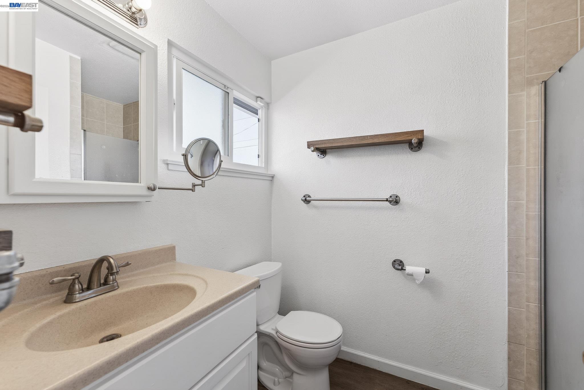 6759 Albyn Court Newark, CA 94560 - Photo 17 of 23 a bathroom with a sink a toilet and a mirror