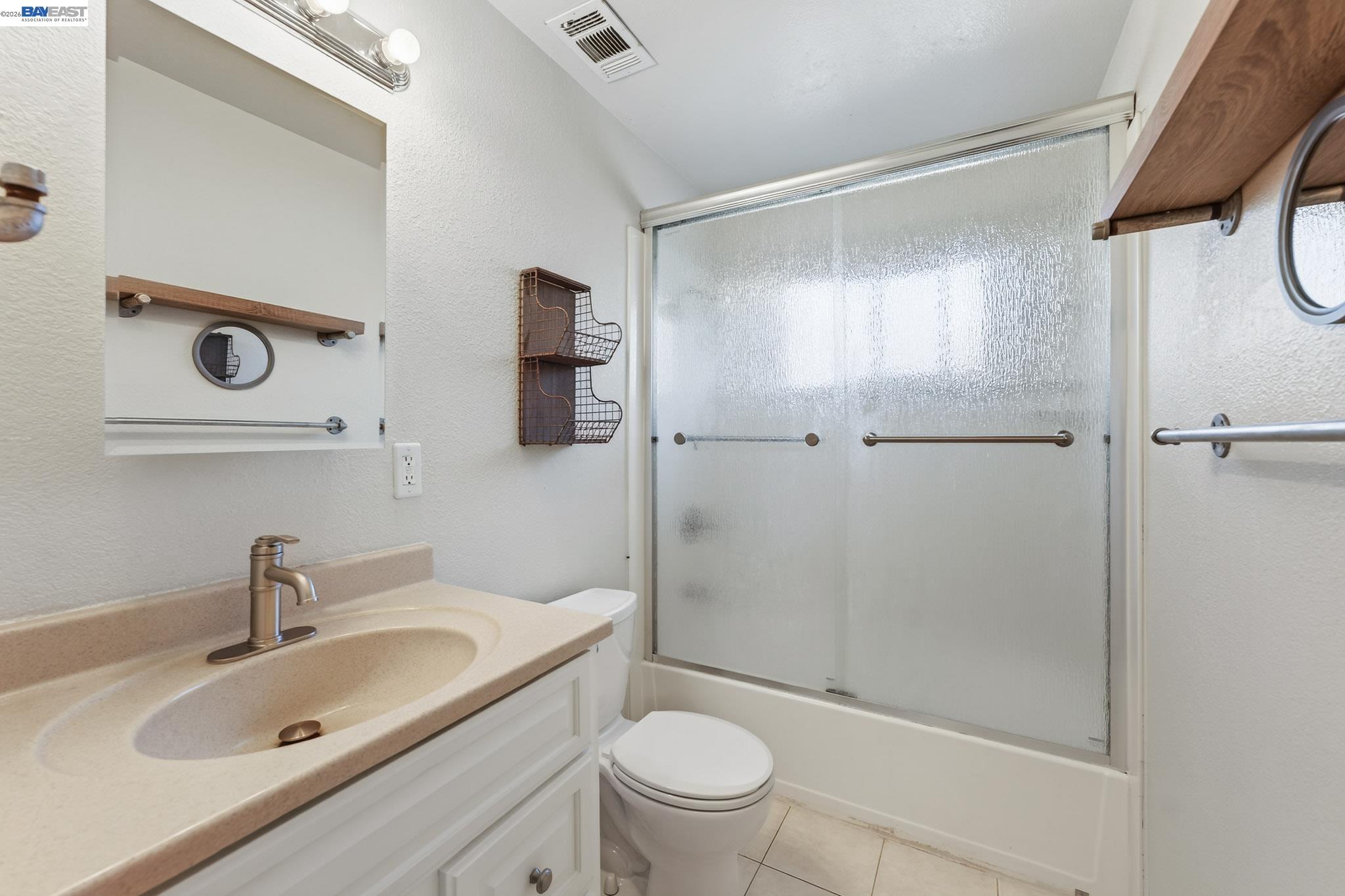 6759 Albyn Court Newark, CA 94560 - Photo 18 of 23 a bathroom with a sink a toilet and shower