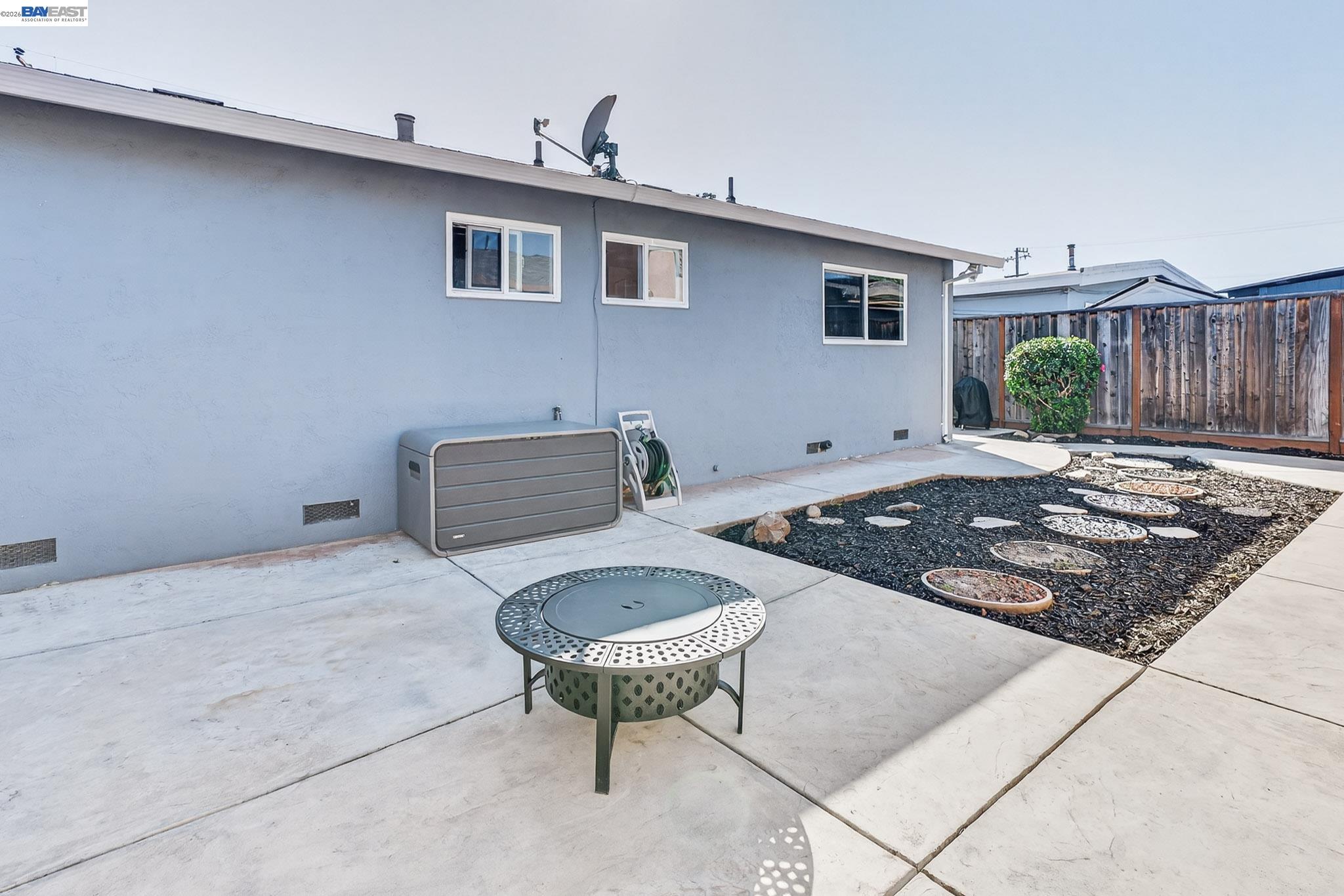 6759 Albyn Court Newark, CA 94560 - Photo 21 of 23 a living room with furniture and a rug