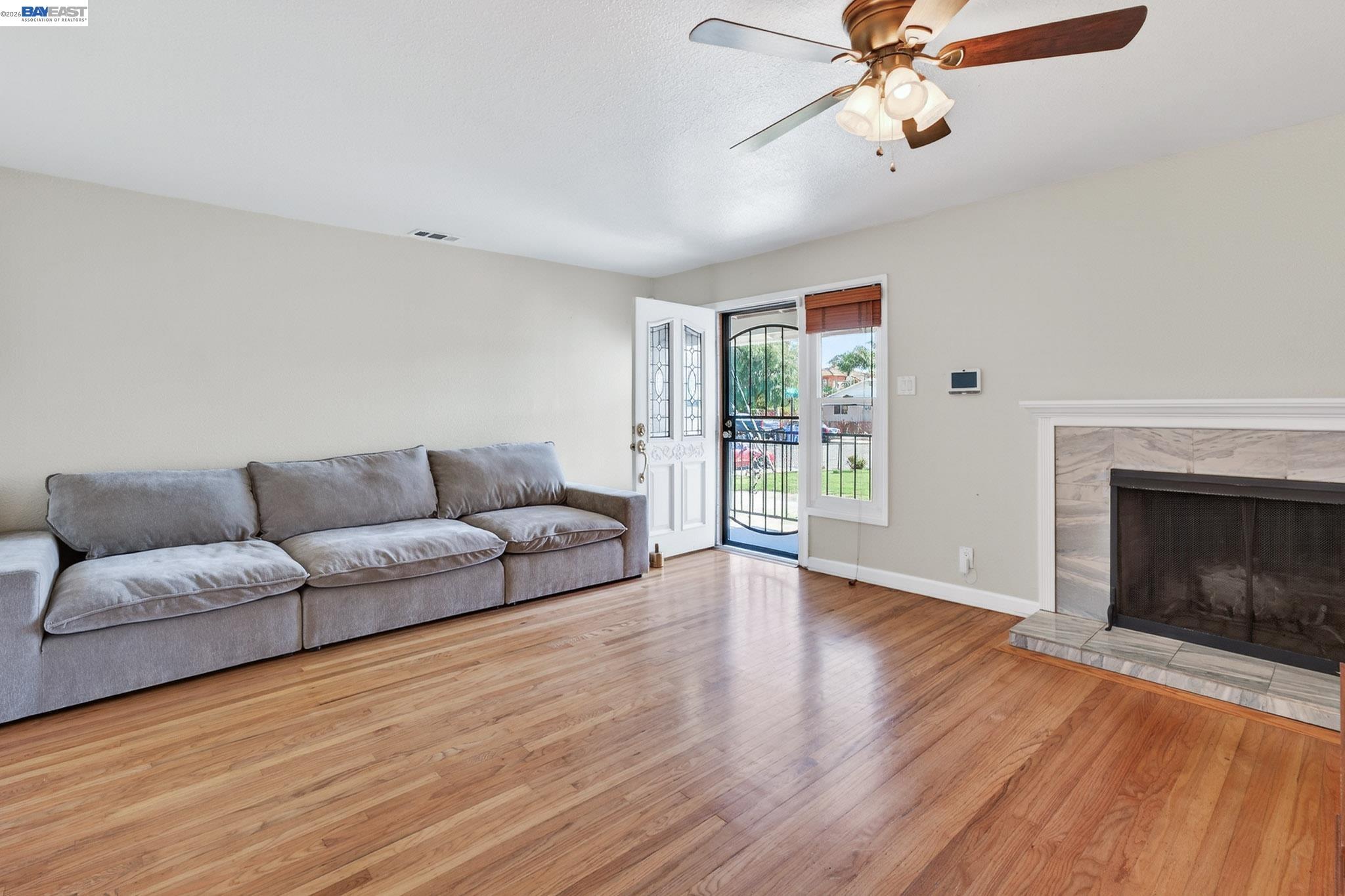 6759 Albyn Court Newark, CA 94560 - Photo 4 of 23 a living room with furniture and a fireplace