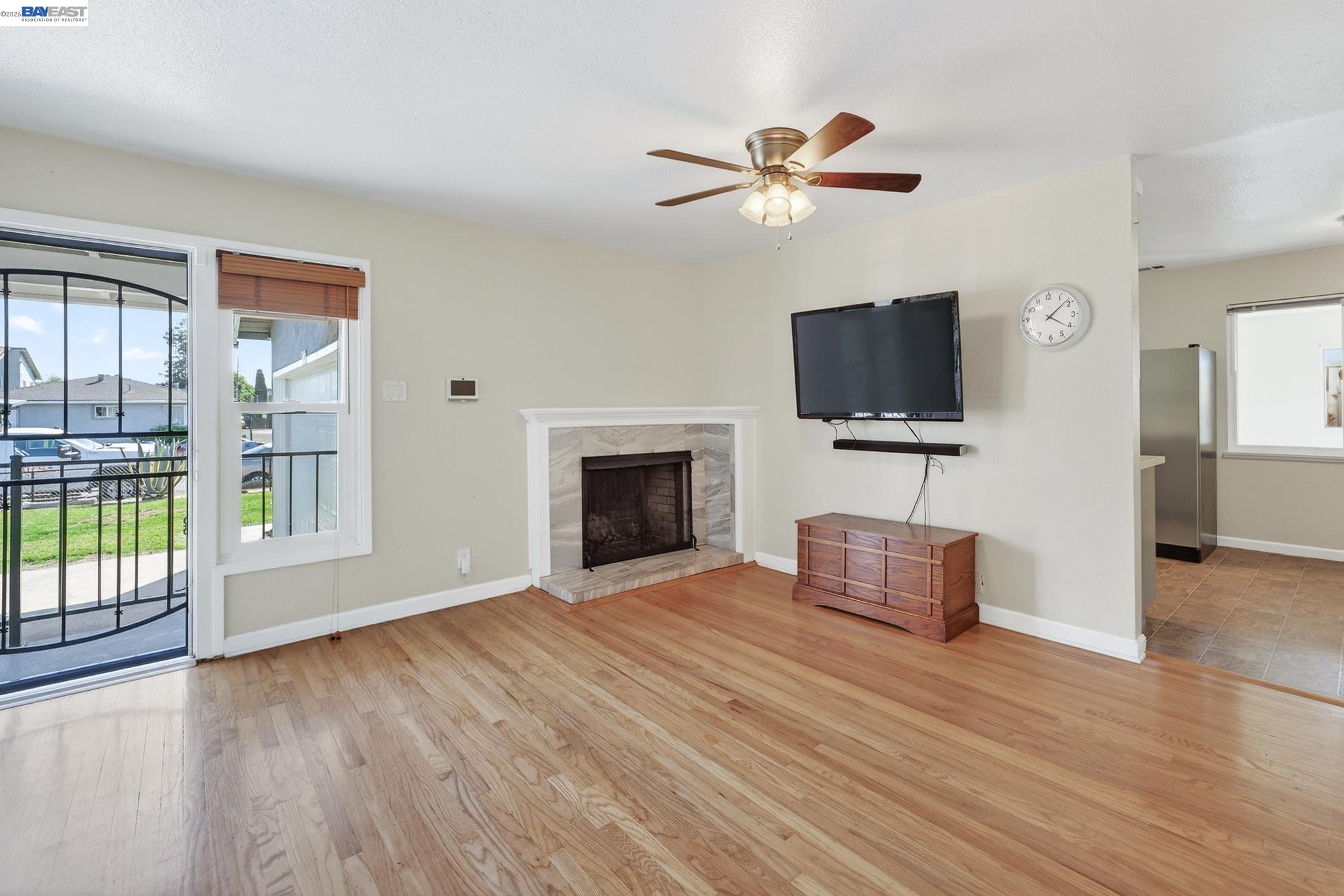 6759 Albyn Court Newark, CA 94560 - Photo 6 of 23 a living room with furniture and a flat screen tv