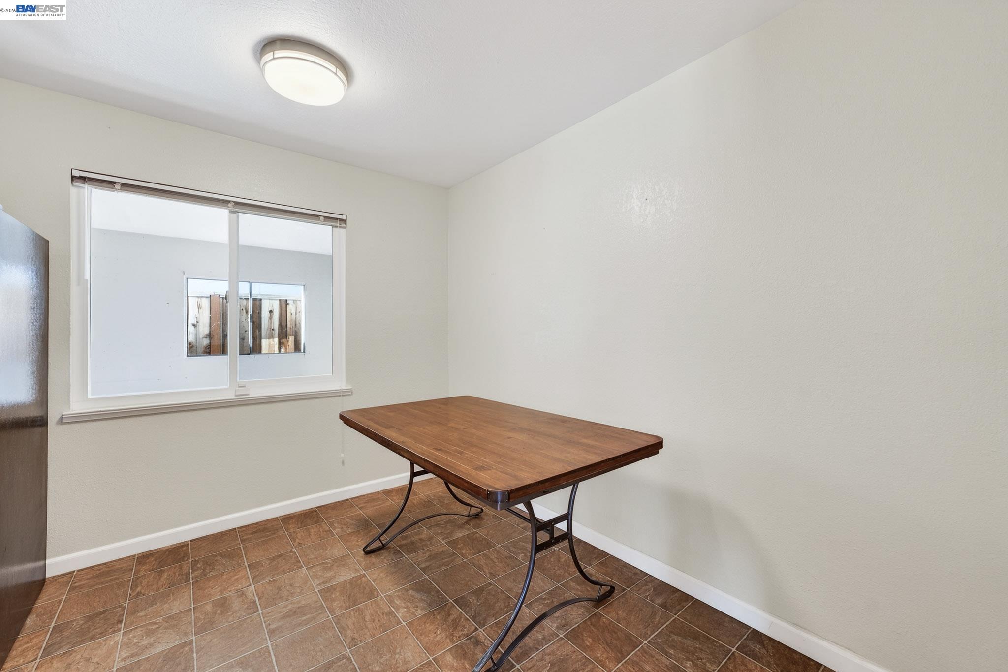 6759 Albyn Court Newark, CA 94560 - Photo 7 of 23 a workspace room with a table and windows