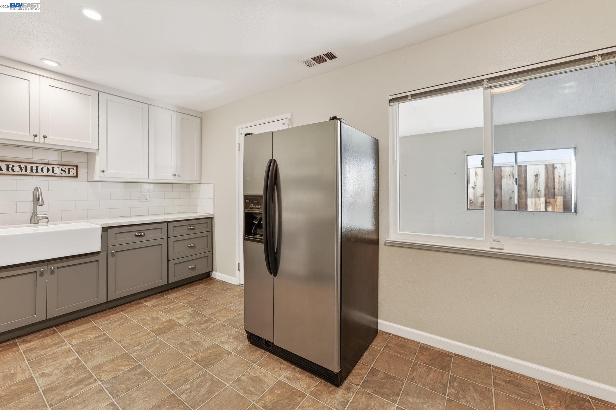 6759 Albyn Court Newark, CA 94560 - Photo 9 of 23 a kitchen with stainless steel appliances a refrigerator sink and cabinets