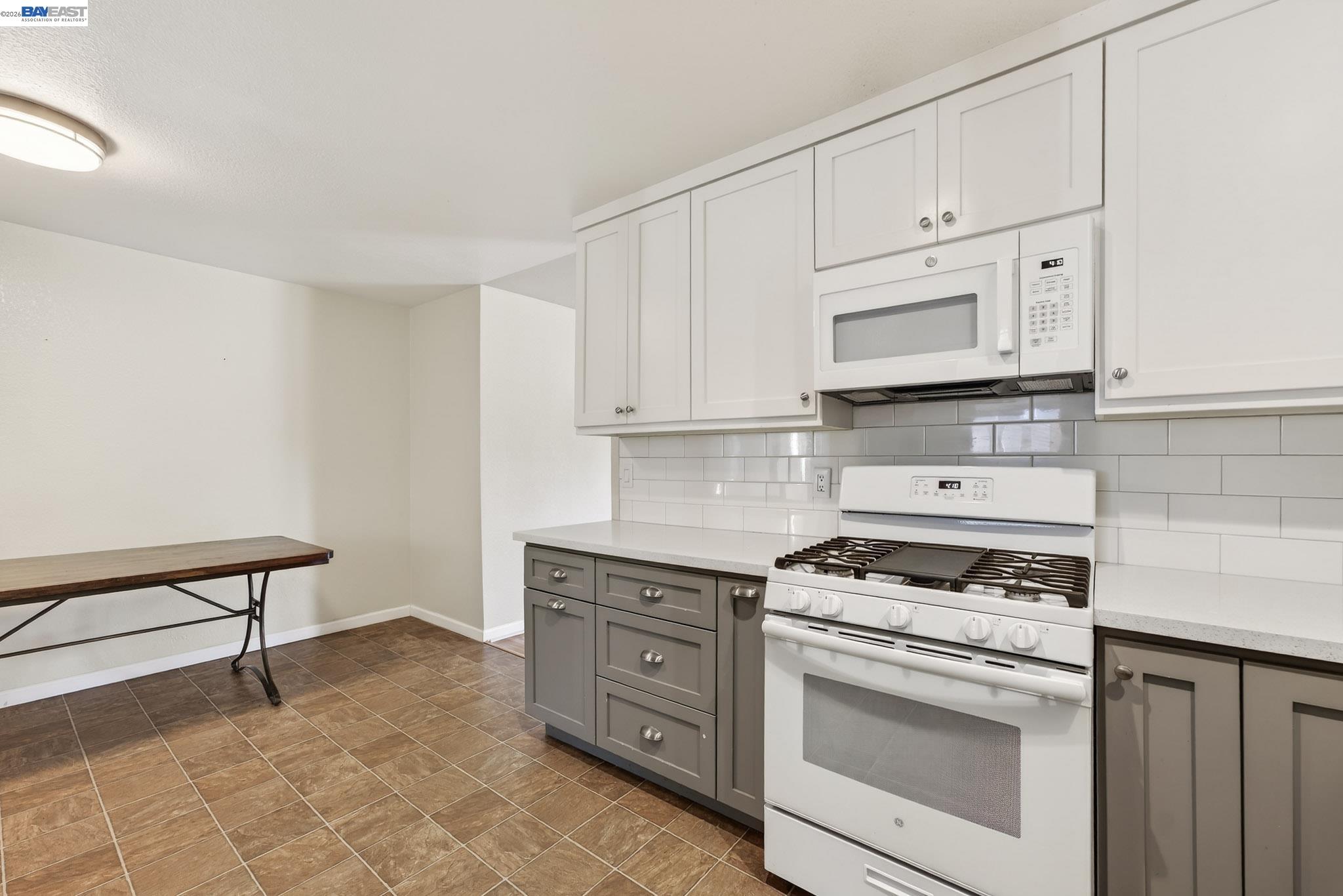 6759 Albyn Court Newark, CA 94560 - Photo 10 of 23 a kitchen with cabinets appliances and a counter space