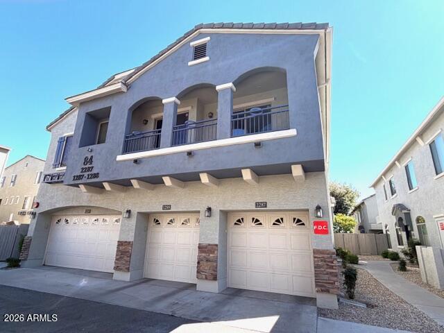 a front view of a house with parking