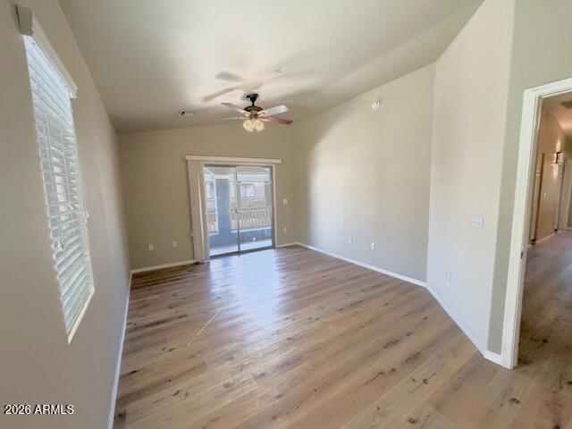 2150 West Alameda Road, Unit 2287 Phoenix, AZ 85085 - Photo 5 of 7 wooden floor in an empty room with a window