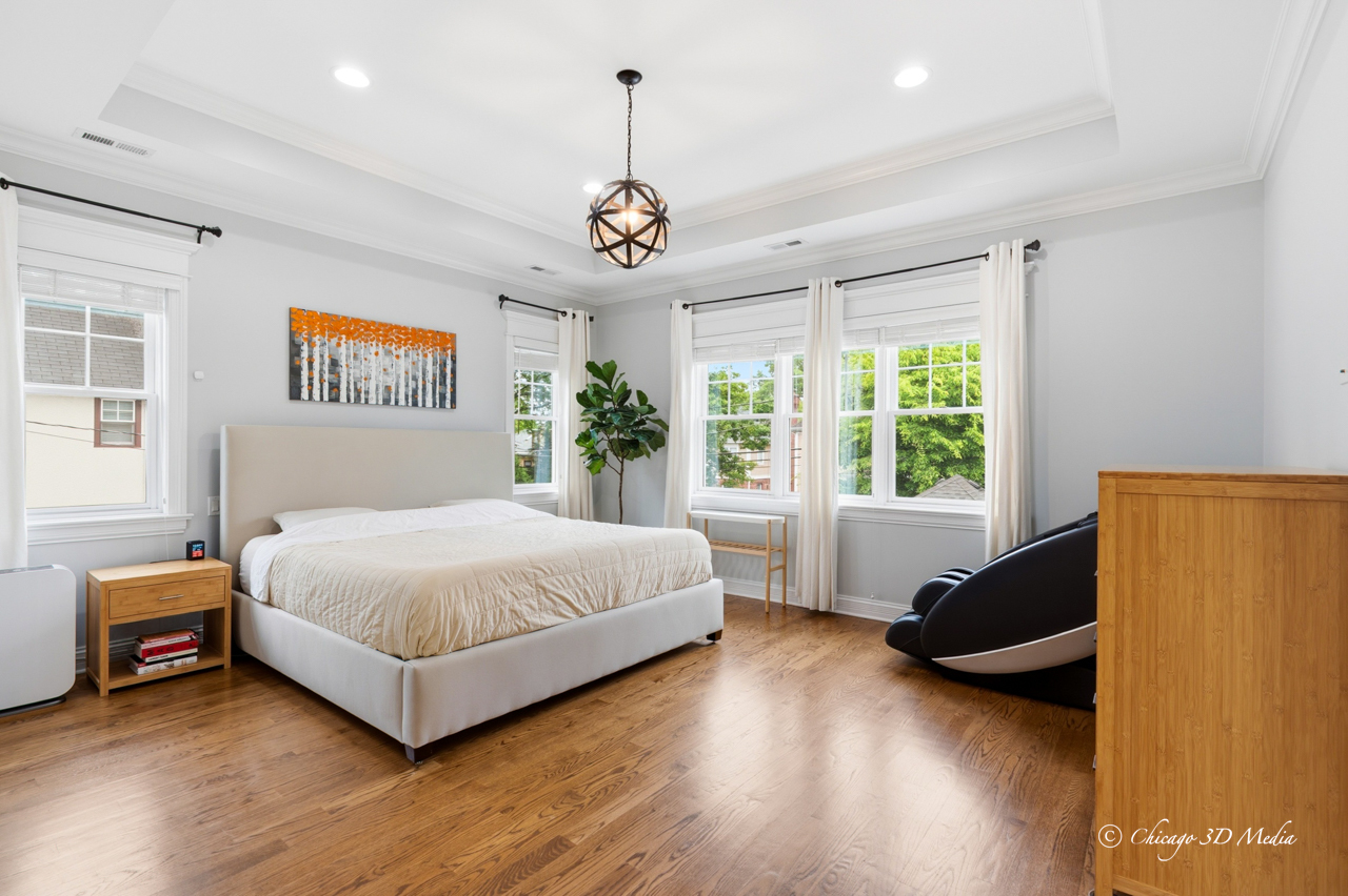 306 17th Street Wilmette, IL 60091 - Photo 24 of 48 a spacious bedroom with a bed and a large window