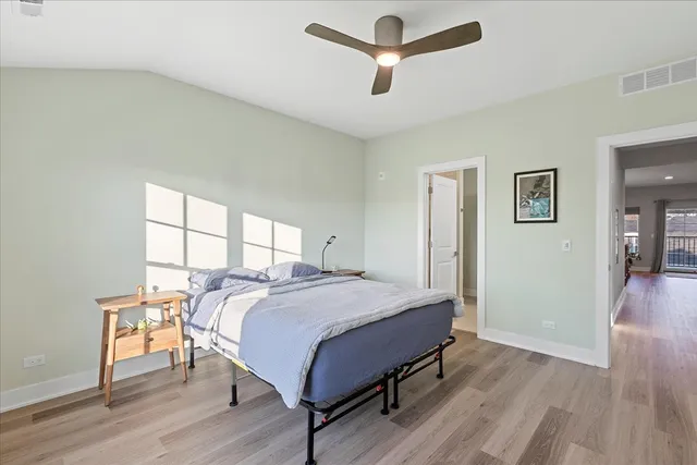 a bed room with a bed and a window