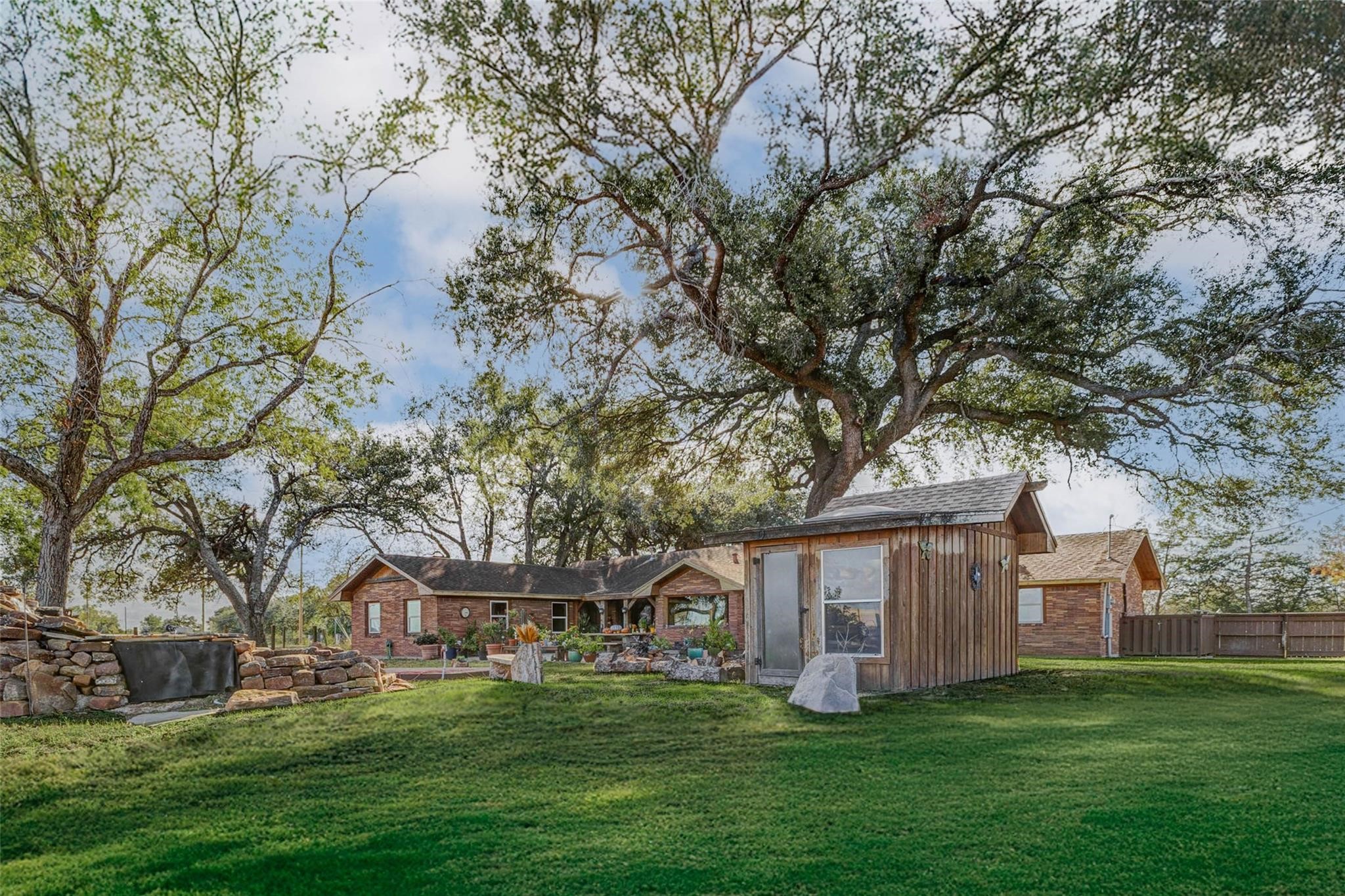 8412 Katy Hockley Road Katy, TX 77493 - Photo 23 of 36 a big white house with a big yard and large trees