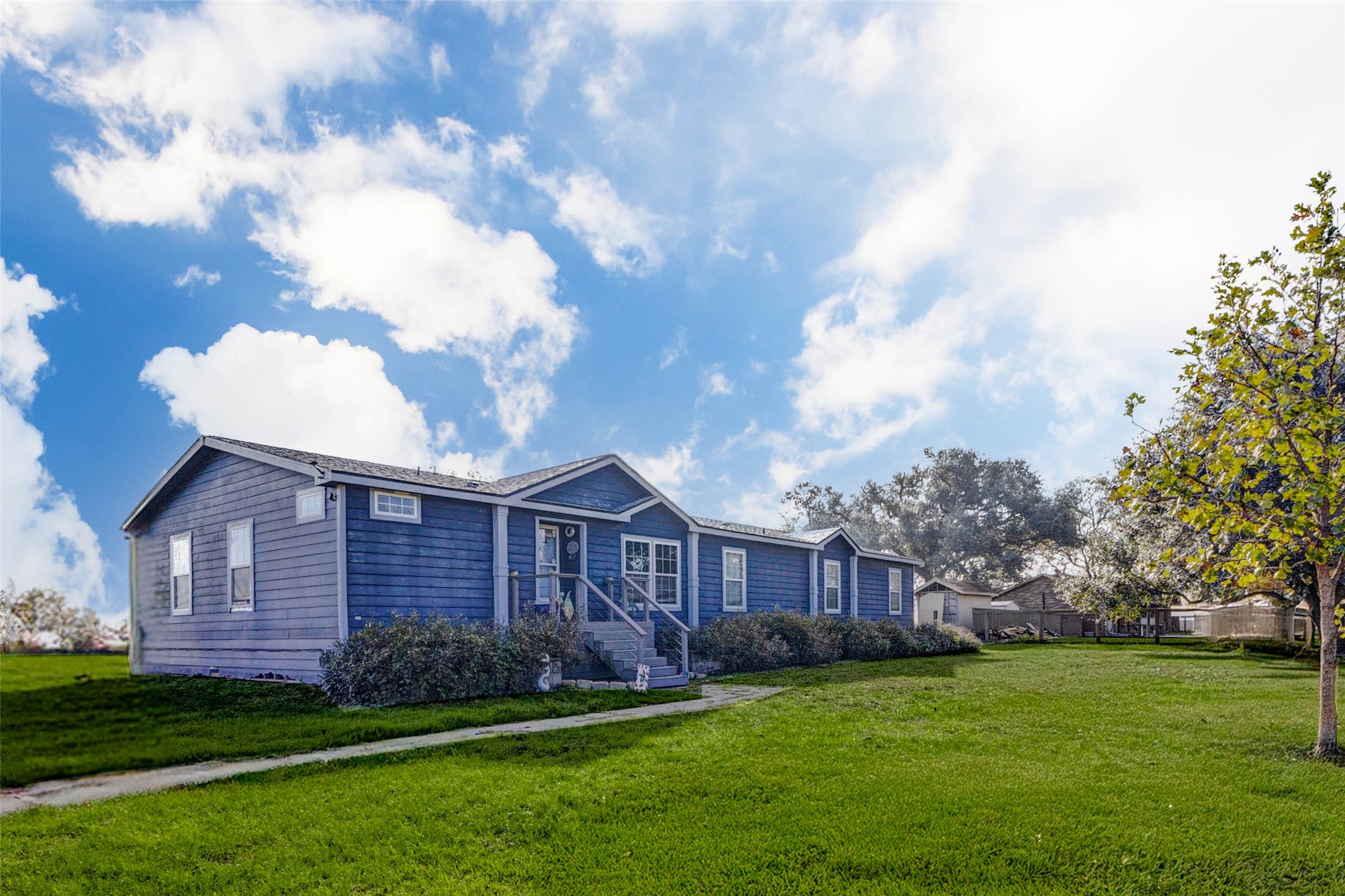 8412 Katy Hockley Road Katy, TX 77493 - Photo 7 of 36 a view of a big yard in front of a house with large tree