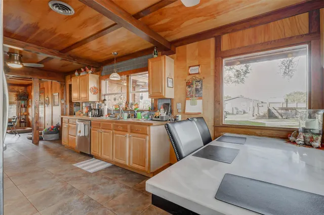 a view of a house with a yard deck and sitting area