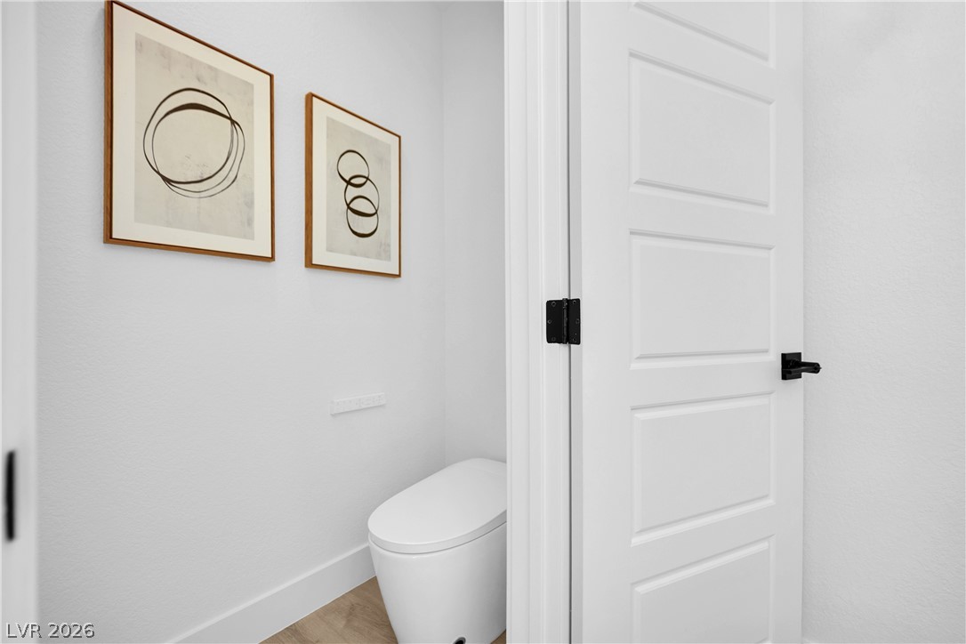 8981 Rivers Edge Drive Las Vegas, NV 89117 - Photo 40 of 69 A well-appointed powder room features clean lines and contemporary decor, offering both privacy and convenience.