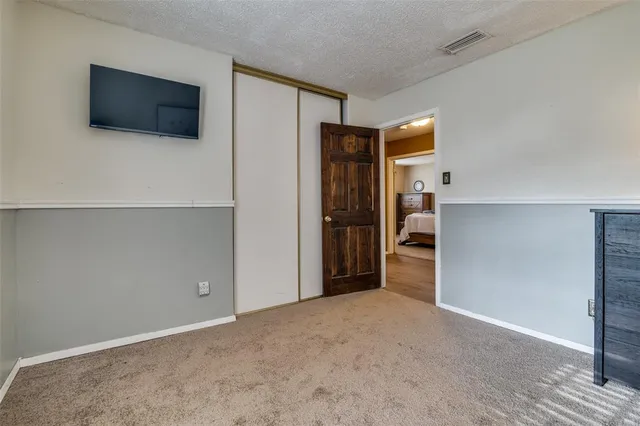 a view of a livingroom with a flat screen tv