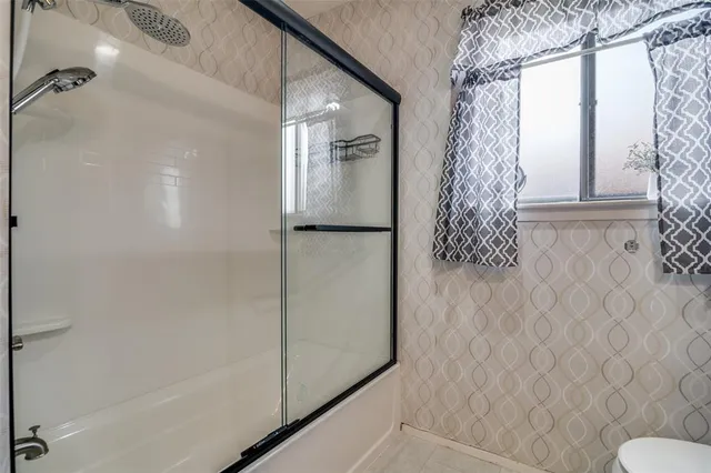 a bathroom with a shower curtain