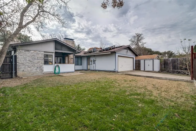 a view of garage and yard