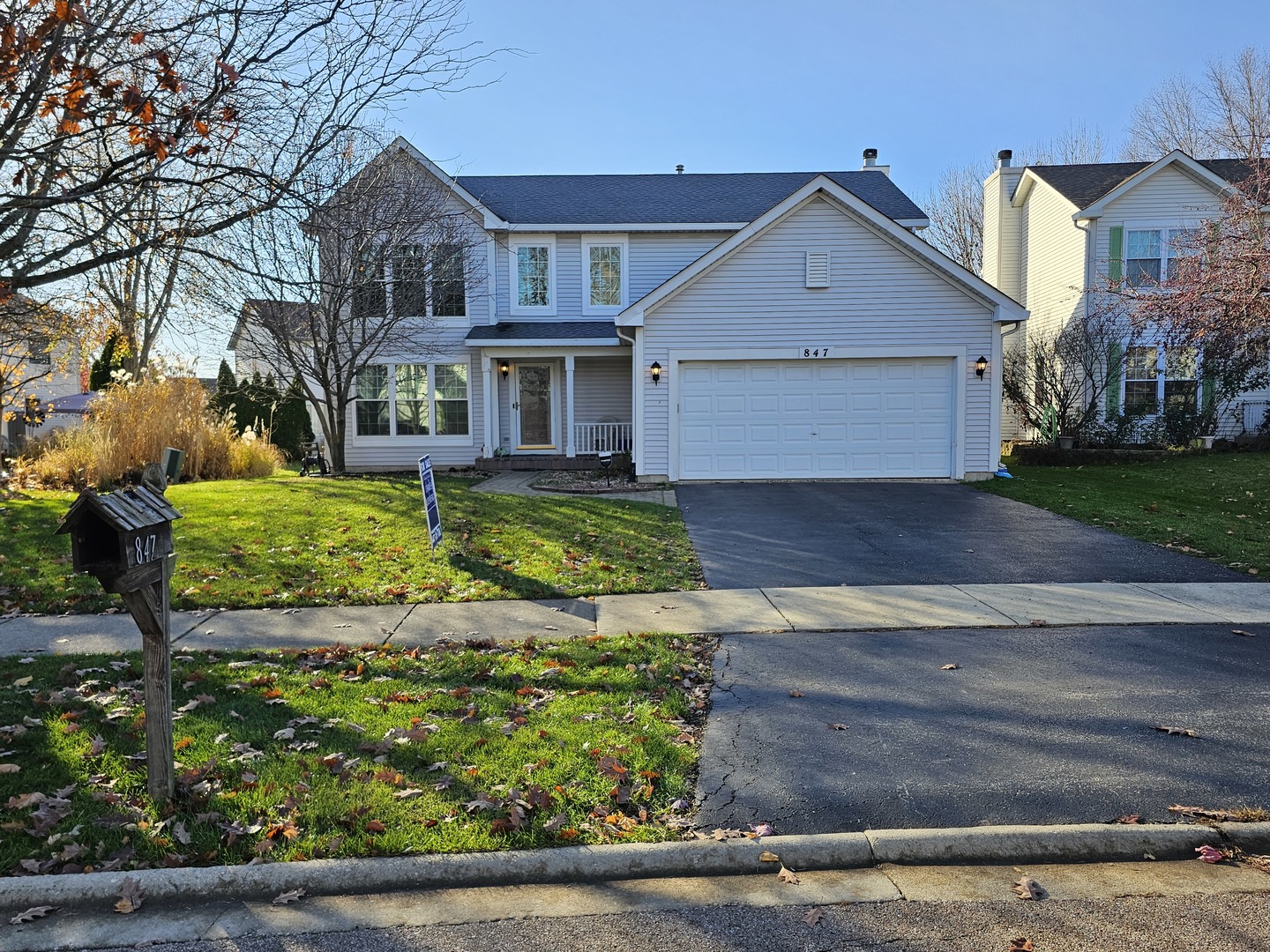 front view of a house with a yard
