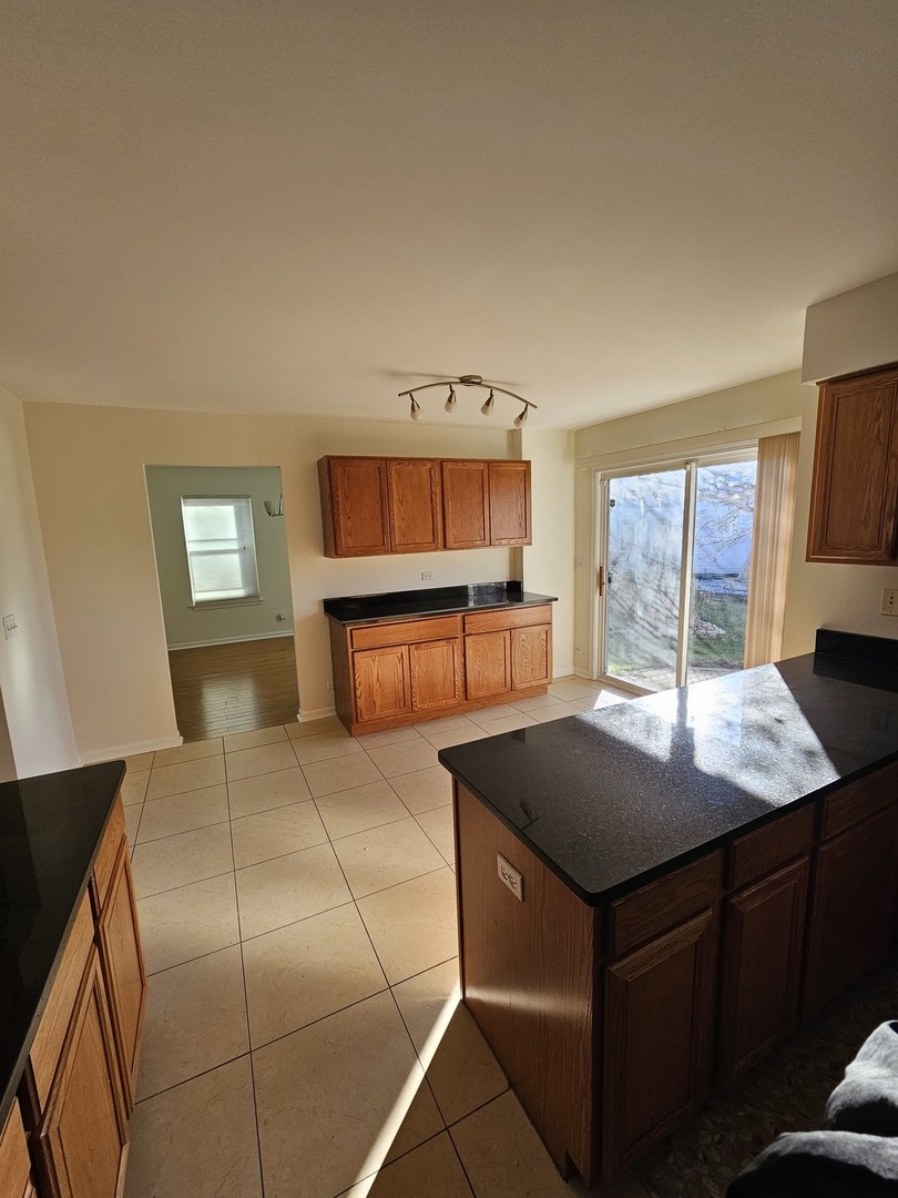 847 Teasel Lane Aurora, IL 60504 - Photo 14 of 46 a bedroom with a bed and window