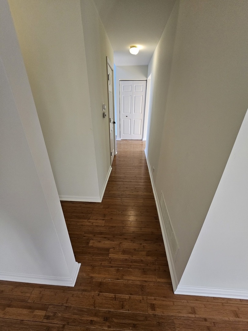 847 Teasel Lane Aurora, IL 60504 - Photo 18 of 46 a view of a hallway with wooden floor
