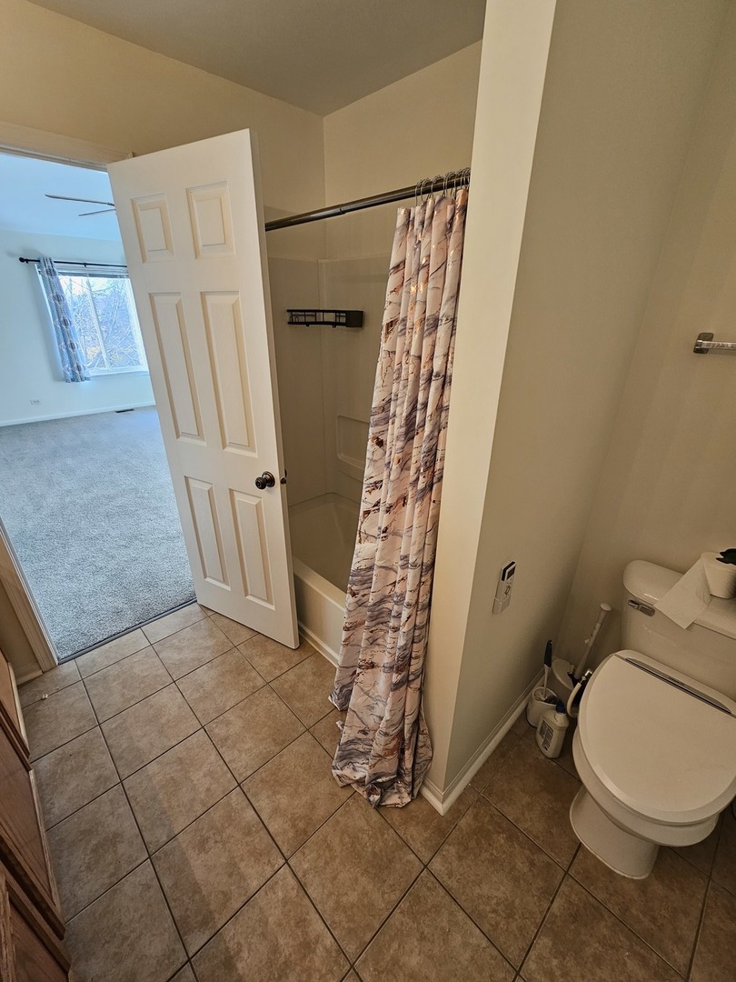 847 Teasel Lane Aurora, IL 60504 - Photo 27 of 46 a bathroom with a granite countertop shower and a toilet