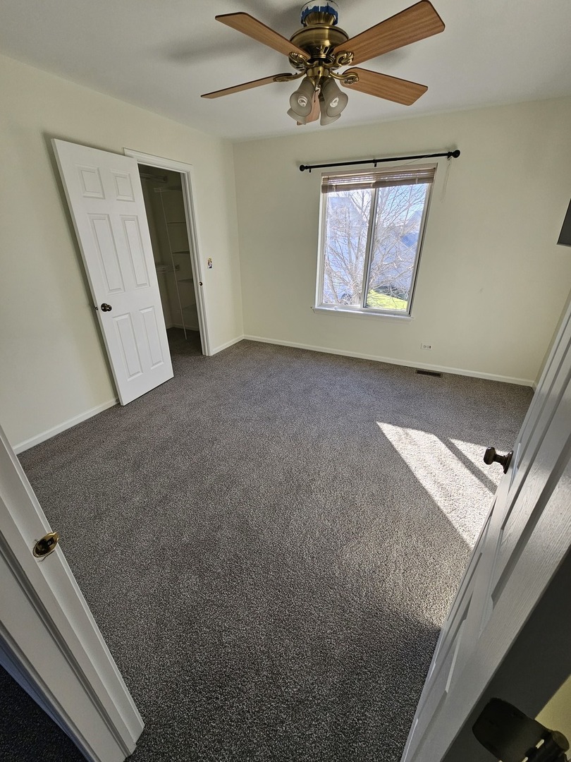 847 Teasel Lane Aurora, IL 60504 - Photo 30 of 46 a view of an empty room and a window