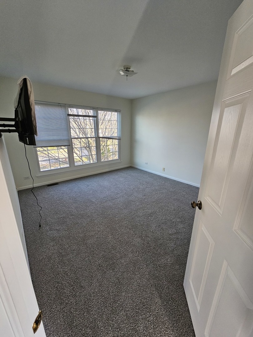 847 Teasel Lane Aurora, IL 60504 - Photo 33 of 46 a view of livingroom with hardwood floor and window