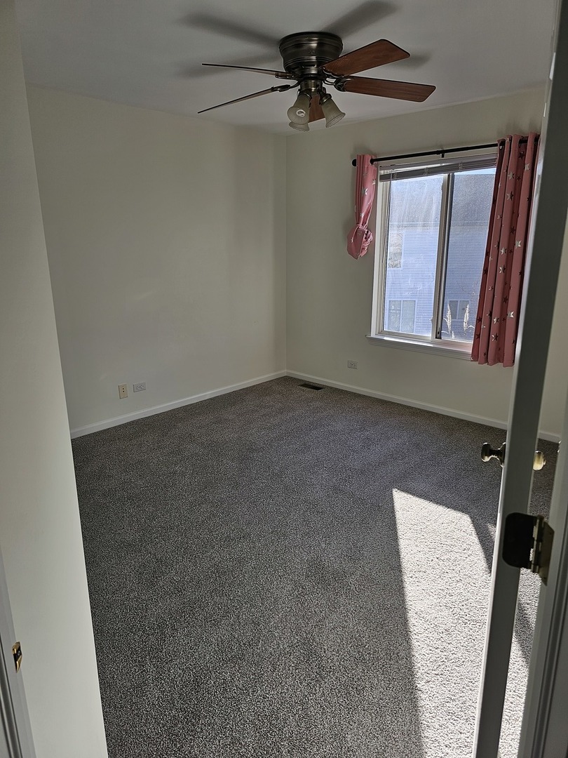 847 Teasel Lane Aurora, IL 60504 - Photo 35 of 46 an empty room with windows