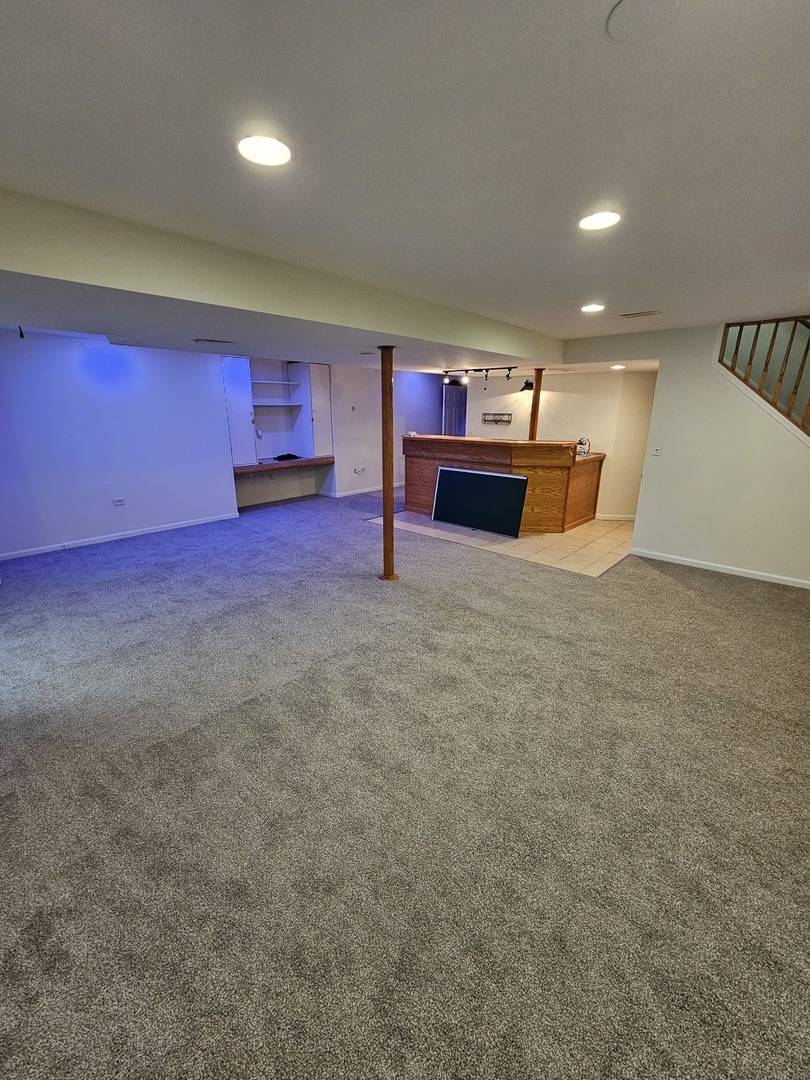 847 Teasel Lane Aurora, IL 60504 - Photo 38 of 46 a view of a room with shelves