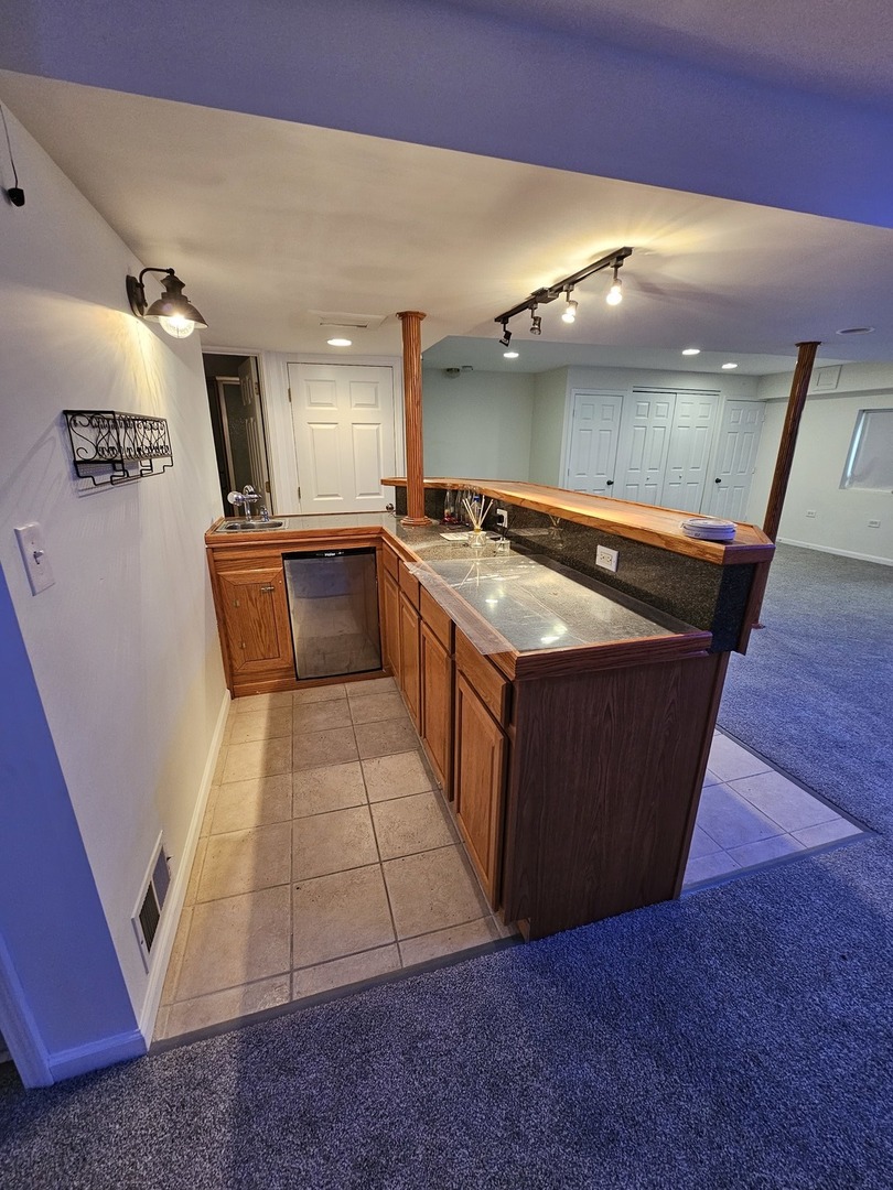 847 Teasel Lane Aurora, IL 60504 - Photo 40 of 46 a large kitchen with stainless steel appliances a large counter top