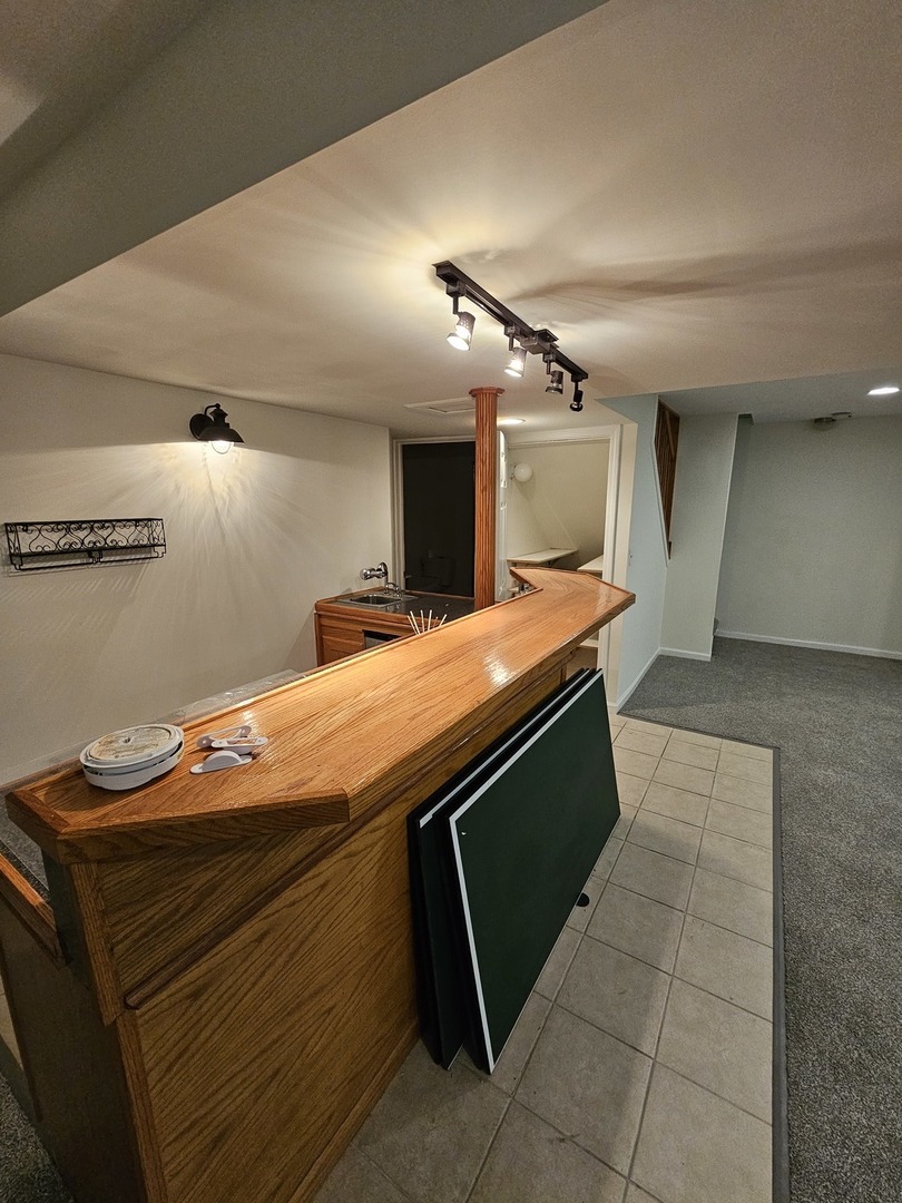 847 Teasel Lane Aurora, IL 60504 - Photo 41 of 46 a room with a table and chairs