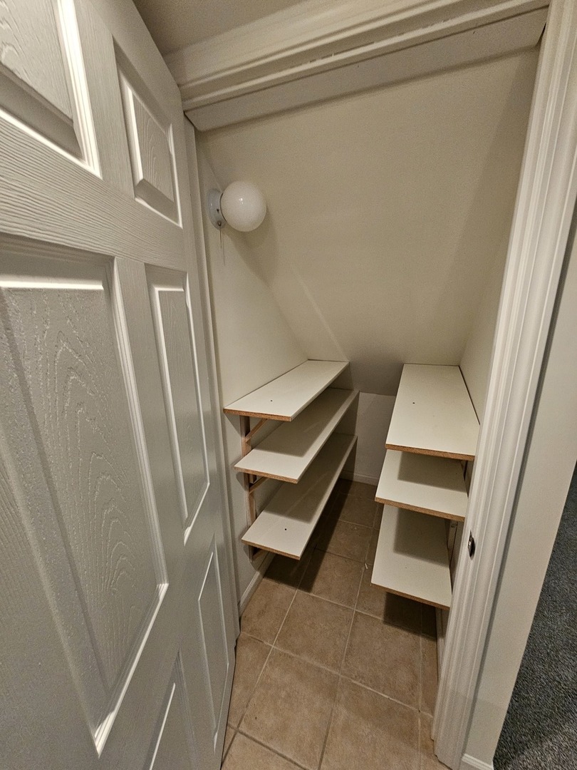 847 Teasel Lane Aurora, IL 60504 - Photo 42 of 46 a room with white walls and a stairs