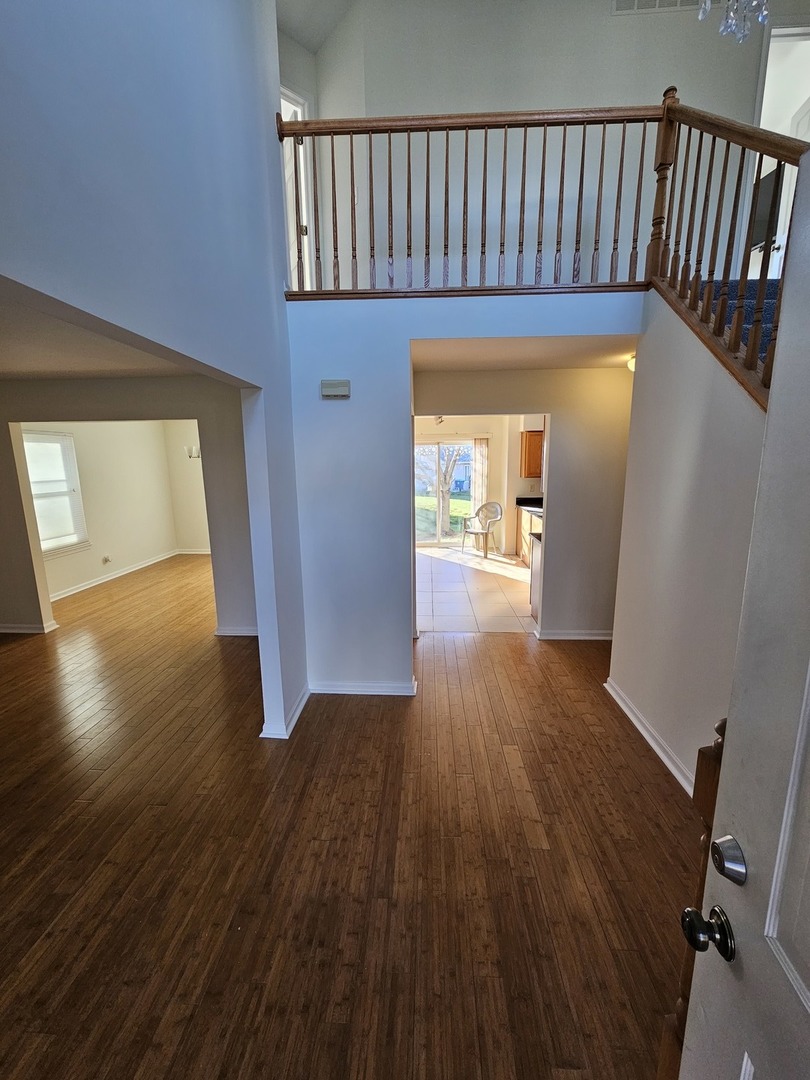 847 Teasel Lane Aurora, IL 60504 - Photo 7 of 46 a view of hallway with wooden floor